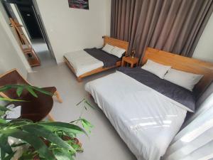 Postel nebo postele na pokoji v ubytování Hello Dalat Hostel