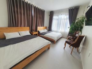 Postel nebo postele na pokoji v ubytování Hello Dalat Hostel