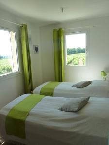 Posteľ alebo postele v izbe v ubytovaní La Vigne