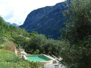 a swimming pool in the middle of a mountain at Le Mont d'Olivine in Utelle