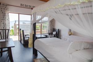 Postel nebo postele na pokoji v ubytování Rushel Kivu Resort kayove