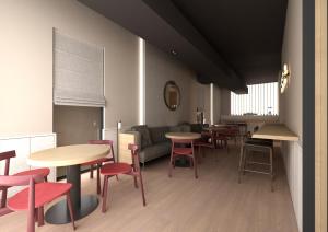 a room with tables and chairs and a couch at Hotel Bono in Budva