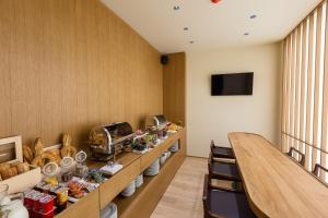 a room with a long counter with food on it at Hotel Bono in Budva