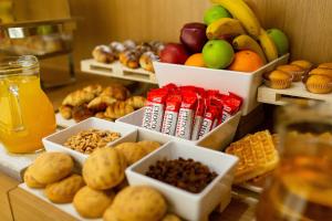 a bunch of different types of food on a table at Hotel Bono in Budva