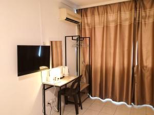 TV a/nebo společenská místnost v ubytování G Star Motel + 8 fotografií