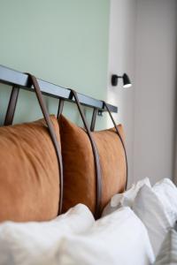 A bed or beds in a room at La Farine Rooms