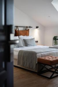 A bed or beds in a room at La Farine Rooms
