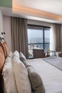 A bed or beds in a room at La Farine Rooms