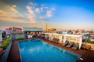 a swimming pool on the roof of a building at Nouvo City Hotel in Bangkok