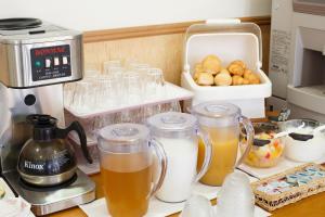 a kitchen counter with several mason jars filled with food at Hotel Peace Island Ishigaki in Yashima in Ishigaki Island