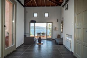 a hallway with a living room with a view of the water at Jasmine by the sea - Κάτω Γατζέα, Πήλιο in Kato Gatzea