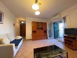 a living room with a couch and a coffee table at APARTMENT LUKA Novalja in Novalja