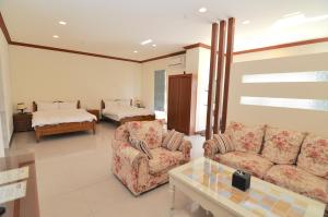 Krevet ili kreveti u jedinici u okviru objekta Xinghai Seaview Guesthouse