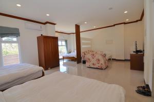 Krevet ili kreveti u jedinici u okviru objekta Xinghai Seaview Guesthouse