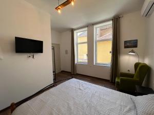 A television and/or entertainment centre at Prista guest rooms