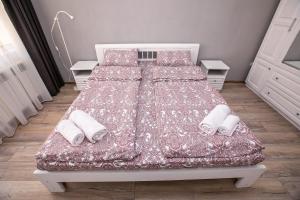 Postel nebo postele na pokoji v ubytování Paradise Apartment