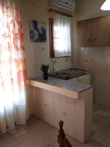 Ванна кімната в Sofia Beach Apartments