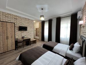 Μια τηλεόραση ή/και κέντρο ψυχαγωγίας στο The Loft Guest House