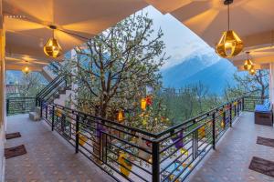 a balcony with a view of a mountain at Zostel Sangla in Sāngla