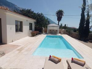 a swimming pool in the backyard of a villa at Ideales Resort in Trapezaki