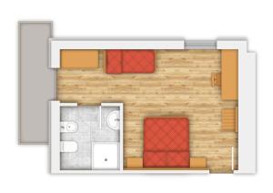 a floor plan of a tiny house with a room at Hotel Majorka in Andalo