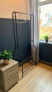 a black iron rack in a room with a window at Apartment in City centre, 4 guests, CAR PARK in Doncaster