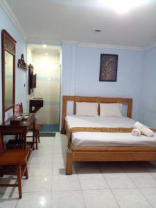 מיטה או מיטות בחדר ב-Hotel Bifa Yogyakarta