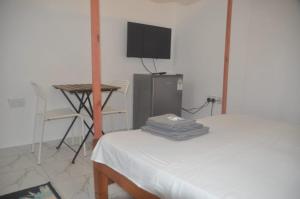 Ein Bett oder Betten in einem Zimmer der Unterkunft Anna Estate