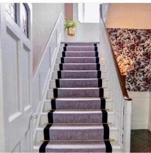 
a row of stairs leading up to a staircase at The Stables Townhouse B&B in Birr
