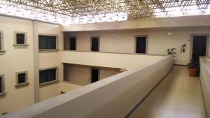 an empty hallway in a building with a ceiling at Hotel Plaza Hidalgo in Ixtlán del Río