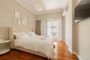 Postel nebo postele na pokoji v ubytování HoneyBee Apartment