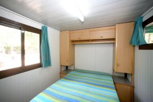 Postel nebo postele na pokoji v ubytování Camping La Gemma