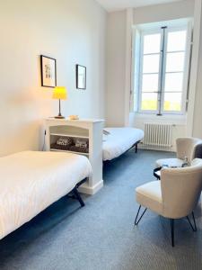 Un pat sau paturi într-o cameră la Domaine du Plessis Grimaud