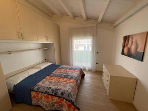 Postel nebo postele na pokoji v ubytování Residence Gianka - Agenzia Cocal