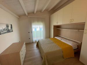 Postel nebo postele na pokoji v ubytování Residence Gianka - Agenzia Cocal