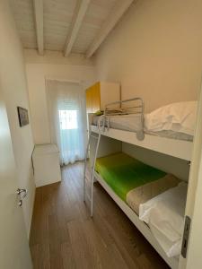 Postel nebo postele na pokoji v ubytování Residence Gianka - Agenzia Cocal