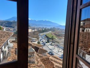 a view of a city from a window at Guest House Mikel in Berat