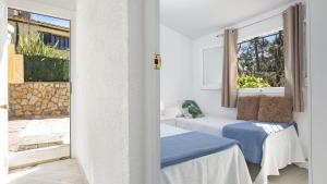 Postel nebo postele na pokoji v ubytování Villa tordera 22