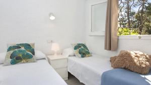 Postel nebo postele na pokoji v ubytování Villa tordera 22