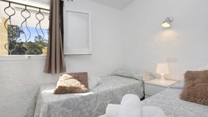 Postel nebo postele na pokoji v ubytování Villa tordera 22