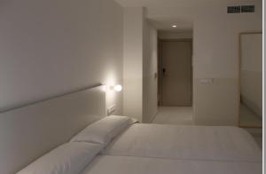 Postel nebo postele na pokoji v ubytování HOTEL LA FONDA B&B