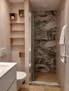 a bathroom with a shower with a glass door at ExcelStay - Balaia in Albufeira