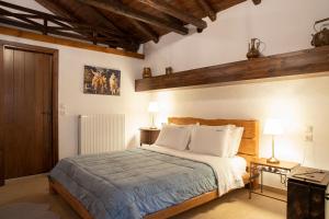 Postel nebo postele na pokoji v ubytování Guesthouse Ourania
