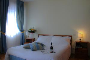 Postel nebo postele na pokoji v ubytování Hotel Belvedere Dolomiti