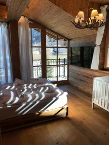 Postel nebo postele na pokoji v ubytování Das Kitz - deLuxe ChaletApartments