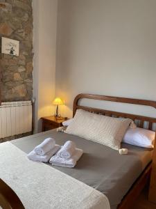 A bed or beds in a room at Masía La Costereta