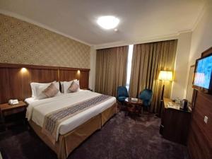 Postel nebo postele na pokoji v ubytování Saraya Harmony Hotel C
