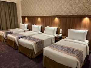 Postel nebo postele na pokoji v ubytování Saraya Harmony Hotel C