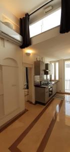 A kitchen or kitchenette at Appartamento Palazzo Ancona