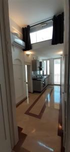 A kitchen or kitchenette at Appartamento Palazzo Ancona